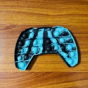 Game controlled shaped push pop bubble sensory fidget toy